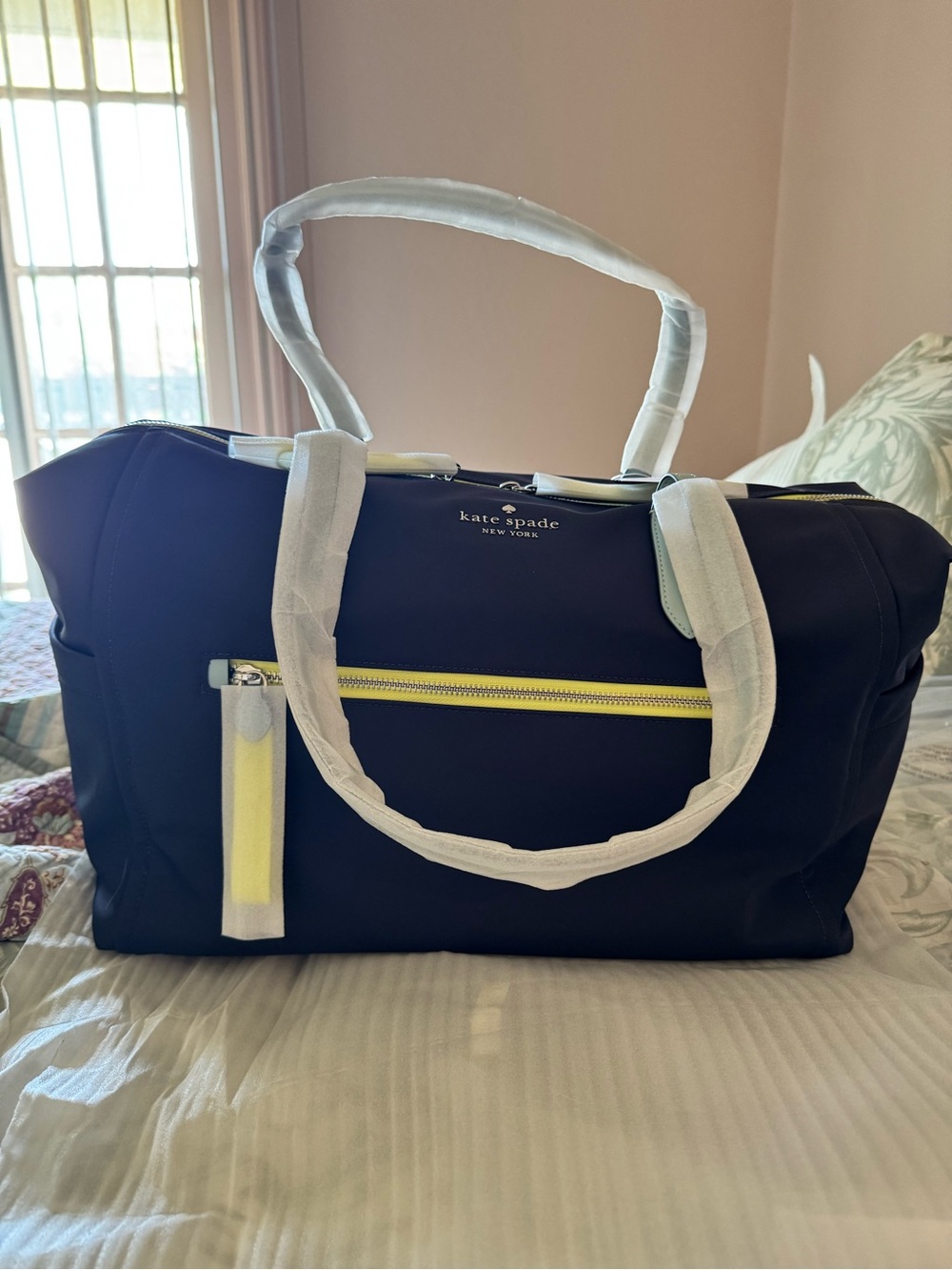NWT, Kate Spade navy/ neon trim duffle .